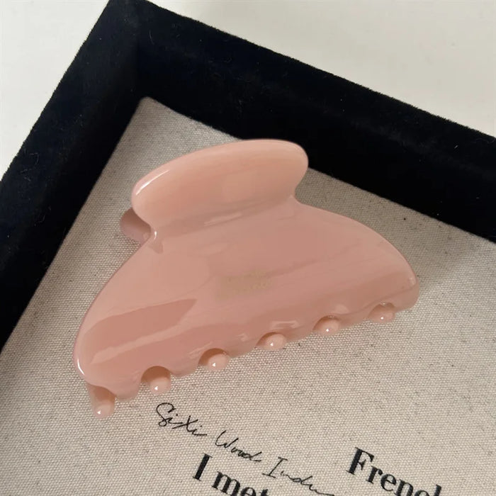 pink claw on white background 